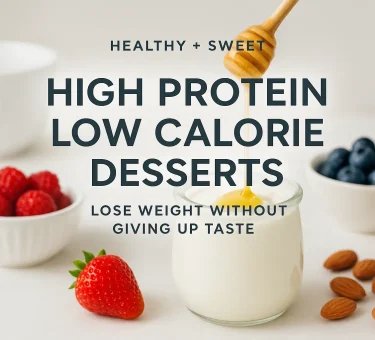 High protein low calorie recipe ingredients including Greek yogurt, berries, lean protein, and healthy meal prep bowls arranged on a clean kitchen surface for a weight-loss friendly dish.